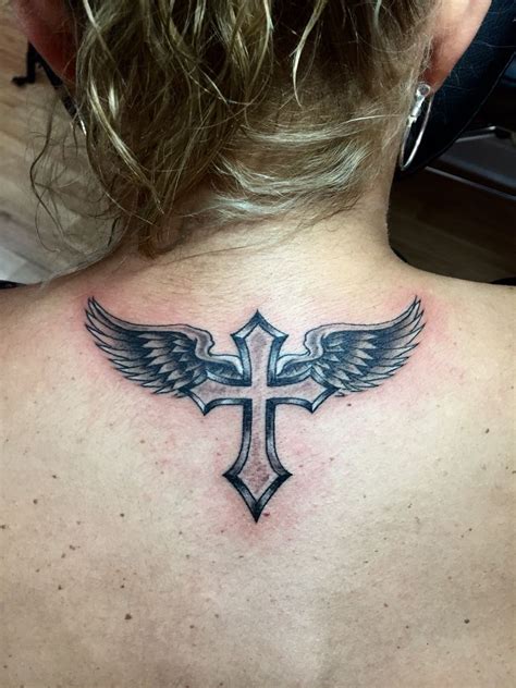 angel on cross tattoo|crosses with wings tattoos.